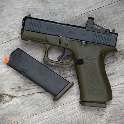 Swampfox Sentinel Micro Reflex GREEN DOT Shake n Wake 3 MOA dot; Streamlight 69286 TLR-6 100 Lumen Pistol Light with Integrated Red Aiming Laser; Custom Kydex Holster Compatible with Glock 43X wTLR-6 -Optic Cut- Inside Waistband Concealed Carry; Gold S15 Mag Catch for Glock 43X (2) Shield Arms S15, flush-fitting, 15 round magazines for Glock 43X. . Glock 43x green dot